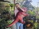 아무스트 공원을 위한 빨간 아기 공룡 손을 집어넣어서 놀리는 꼭두각시